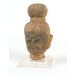 Property of a gentleman - an antique carved stone Buddha head, South East Asia, mounted on a perspex