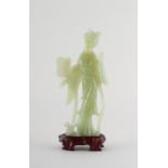 Property of a deceased estate - a Chinese carved bowenite figure of Guanyin, on fitted wooden stand,