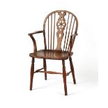 Property of a lady - a 19th century fruitwood Windsor wheel-back elbow chair, with turned legs &