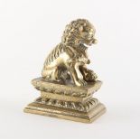 A Chinese polished bronze Buddhistic lion, 19th century, 4.15ins. (10.5cms.) high.