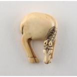 Property of a gentleman - a Japanese carved ivory netsuke modelled as a grazing horse, 18th / 19th