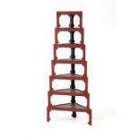 Property of a lady - a graduated set of seven Japanese cinnabar lacquer stacking corner shelves or