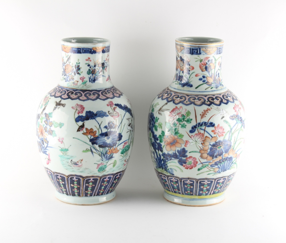 Two very similar late 19th century Chinese famille rose vases, painted with birds among flowering