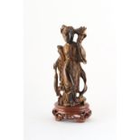 Property of a deceased estate - a Chinese carved tiger's eye figure of Guanyin, on fitted wooden