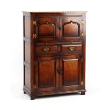 Property of a gentleman - a good quality reproduction oak court cupboard with an arrangement of