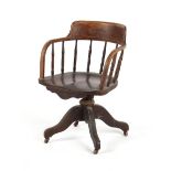 Property of a deceased estate - a late 19th / early 20th century oak swivel desk chair, with brown