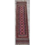 Property of a lady - an Afghan runner with kelim ends, 107 by 26ins. (272 by 66cms.).