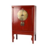 Property of a gentleman - an early 20th century Chinese red lacquer marriage or wedding cabinet, the