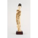 Property of a gentleman - a Chinese carved ivory figure of a lady in flowing robes, 19th century,