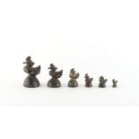 Property of a gentleman - a graduated set of six bronze opium weights modelled as birds, the tallest