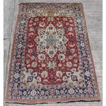 Property of a gentleman - a Persian Tabriz small carpet with red ground, pronounced abrash to one