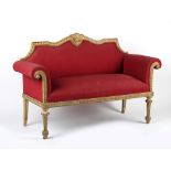 Property of a deceased estate - an early 20th century carved & painted sofa with scroll arms, the