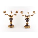 Property of a deceased estate - a pair of ormolu or gilt brass & serpentine marble twin light