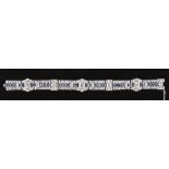A fine diamond & sapphire bracelet, of Art Deco design, set with rectangular cut sapphires