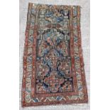 Property of a lady - an early 20th century Caucasian Kazak rug, 84 by 43ins. (214 by 110cms.).