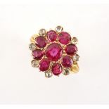 A fine antique ruby & diamond flowerhead cluster ring, set with nine certificated unheated Burmese
