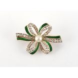 An early 20th century unmarked yellow gold pearl diamond & green enamel ribbon brooch, the old eight