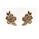 A pair of unmarked yellow gold ruby & diamond earrings, of floral form, each set with five rose
