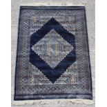 Property of a gentleman - a good quality hand knotted part silk rug, Pakistan, with navy ground,