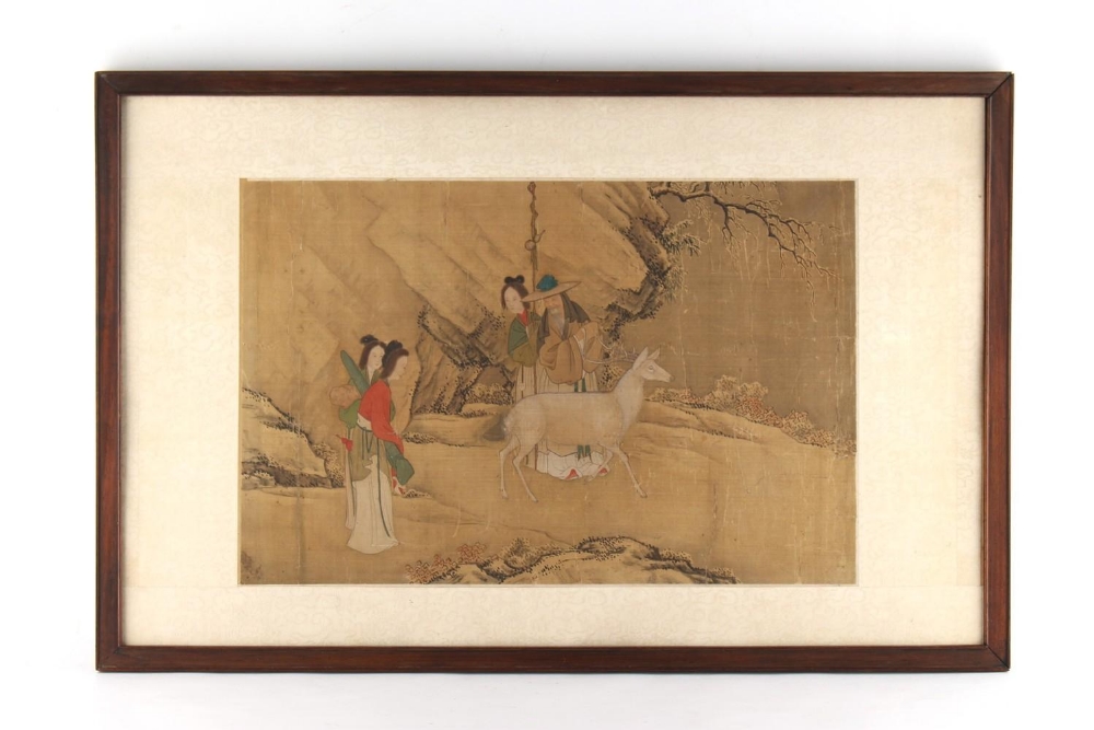 An 18th century Chinese painting on silk depicting four figures & a deer in landscape, the