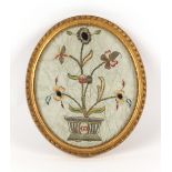 Property of a gentleman - a 19th century silkwork & metal thread oval picture depicting flowers in a