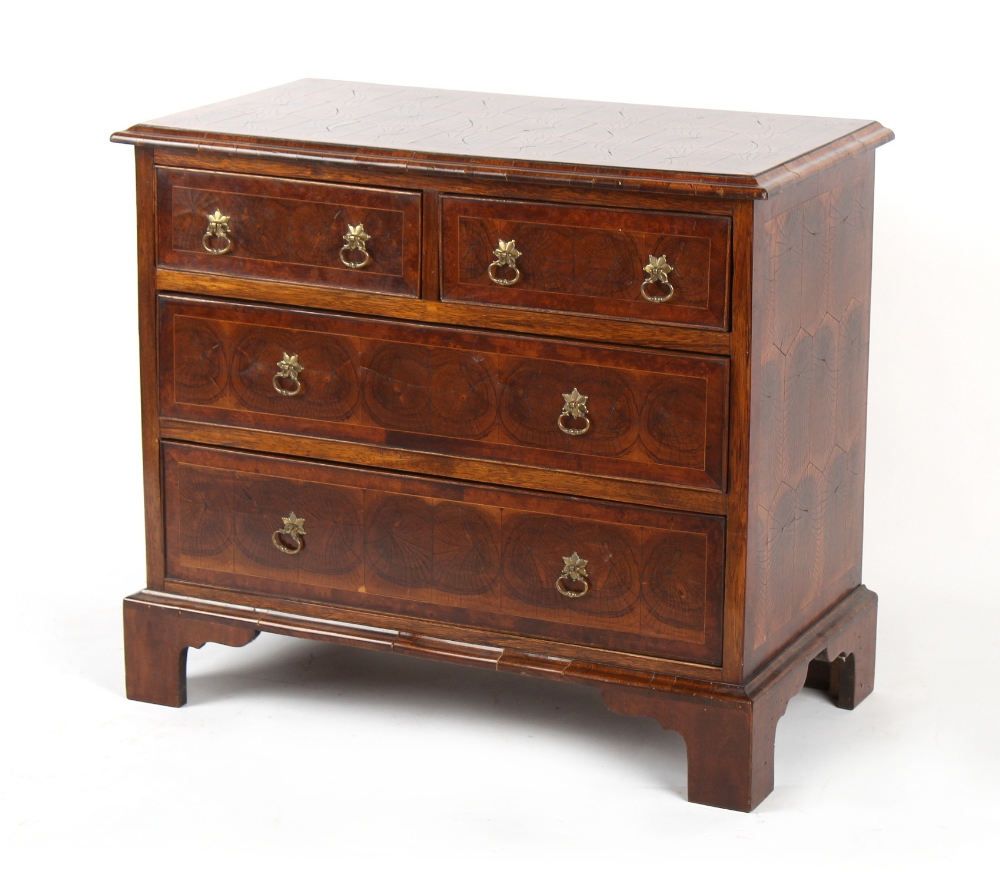 Property of a gentleman - an oyster walnut veneered chest of two short & two long graduated