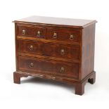 Property of a gentleman - an oyster walnut veneered chest of two short & two long graduated