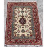 Property of a gentleman - a finely woven Kashan rug with ivory field, 80 by 56ins. (203 by
