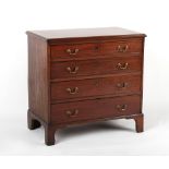 Property of a lady - a small George III mahogany chest of four long graduated drawers, 29.25ins. (