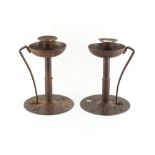 A pair of Arts & Crafts Coberg steel chambersticks or candlesticks, one stamped 'COBERG / GES.