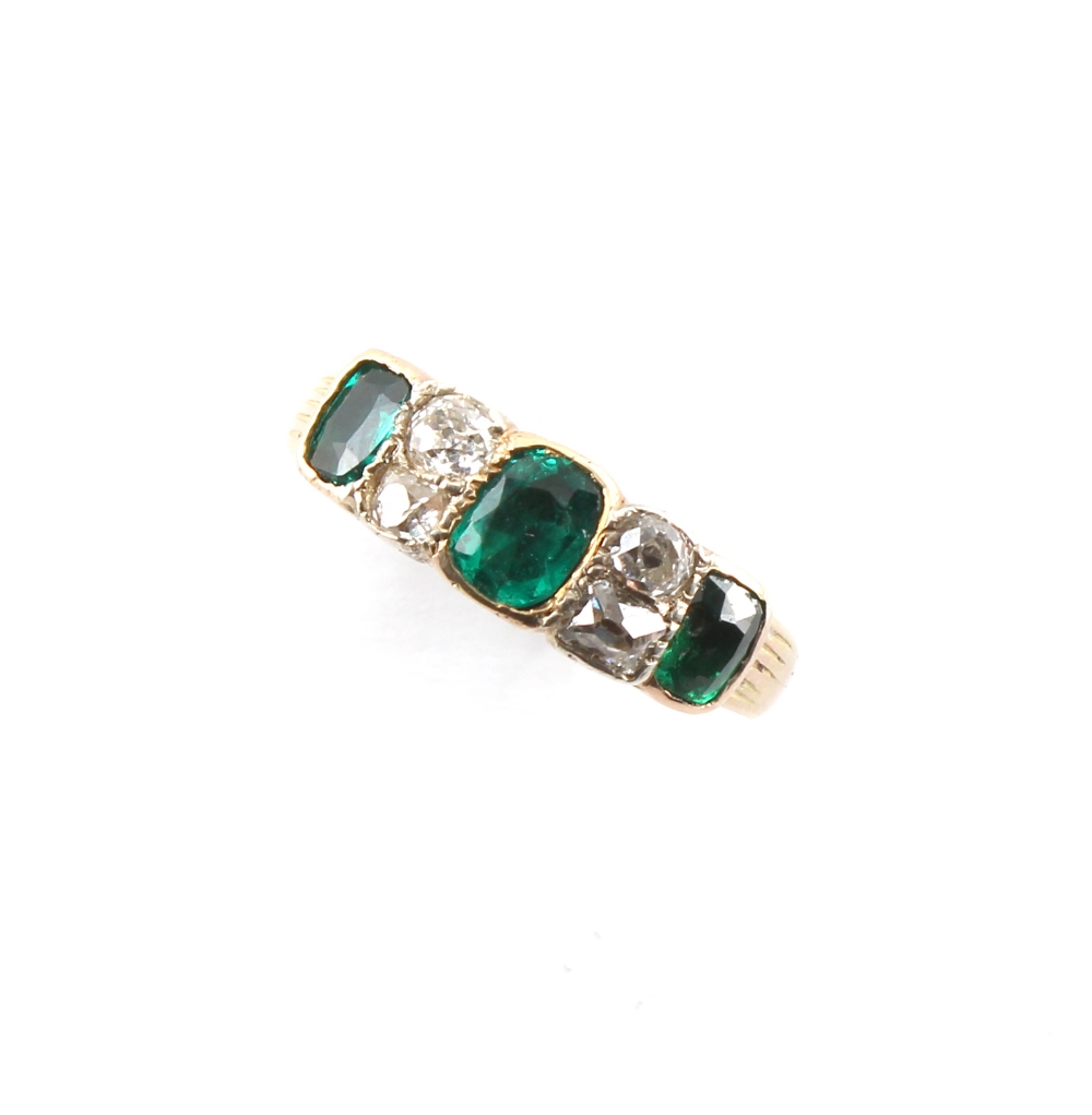 A good Georgian emerald & diamond ring, the three vibrant green emeralds of good clarity, in rub-