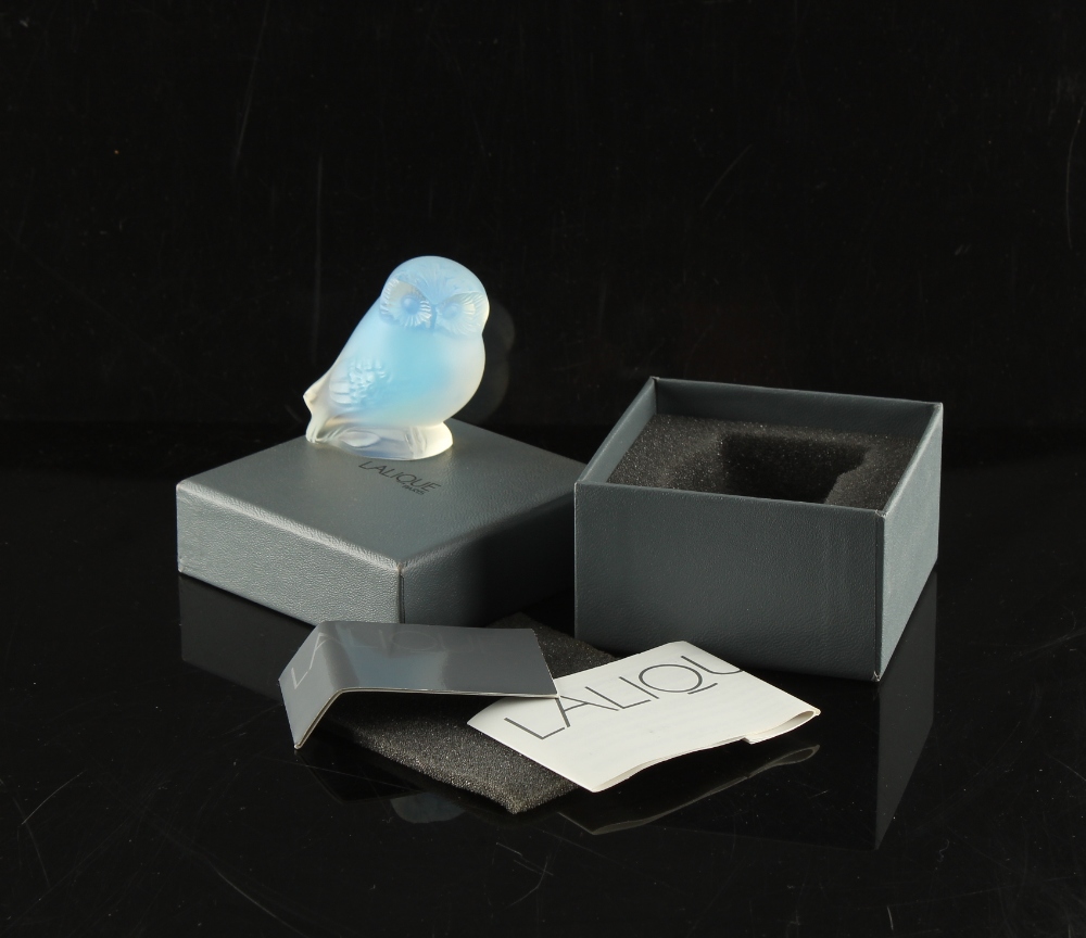 A Lalique opalescent glass model, Owl Nyctal, circa 1993, 2.25ins. (5.7cms.) high, in original box.