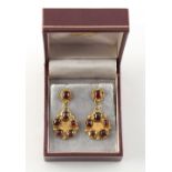 A pair of 18ct yellow gold cabochon garnet earrings, with post & butterfly fastenings, maker's