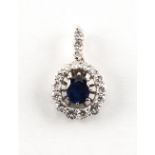 An 18ct white gold sapphire & diamond pendant, the oval cut sapphire weighing approximately 1.45