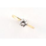 An 18ct yellow gold diamond single stone ring, the round brilliant cut diamond weighing