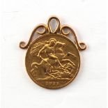 A 1911 George V gold half sovereign coin pendant, approximately 4.7 grams.