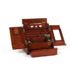 A Victorian mahogany stationery box, with sloping two-door front enclosing compartments, 13.5ins. (