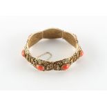 A Chinese silver gilt filigree & coral panel bracelet, approximately 45.6 grams.