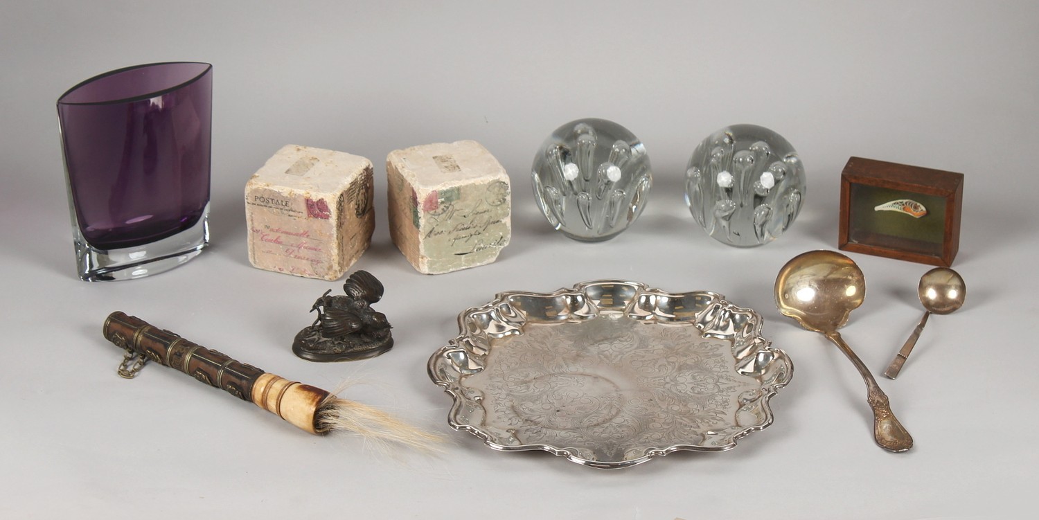 A group of decorative items including two glass dump weights with bubble decorations, each