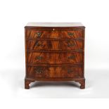A Bevan & Funnell Reprodux mahogany bow-fronted chest of four long graduated drawers, on bracket