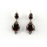 A pair of 19th century cabochon garnet & rose cut diamond pendant earrings, for pierced ears, with