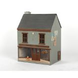 A doll's house entitled 'Hartman Toys Fabric', with furniture & furnishings, 19ins. (48cms.) long.