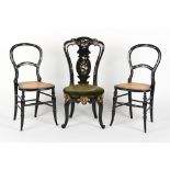 A pair of Victorian black papier mache & mother-of-pearl inlaid cane seated bedroom chairs; together