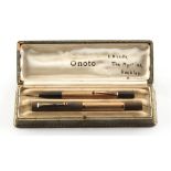 An Onoto fountain pen with 9ct gold barrel, nib missing, London 1934; together with a similar