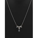 A black opal & diamond pendant on platinum chain necklace, the ribbon & pendant approximately 21mm