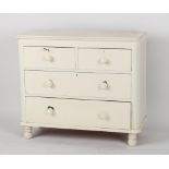A Victorian white painted pine chest of two short & two long graduated drawers, 40.5ins. (103cms.)