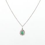 An emerald & diamond pendant, the pear shaped cabochon emerald weighing suspended in a pear shaped