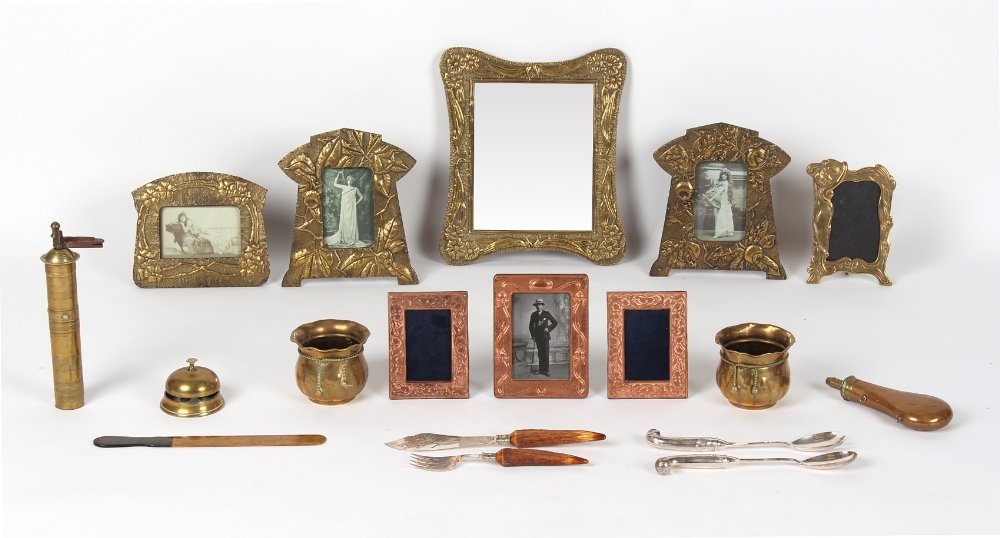 A box containing assorted metal items including Art Nouveau style photograph frames and a