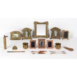 A box containing assorted metal items including Art Nouveau style photograph frames and a