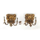 A pair of late 19th century giltwood & gilt composition triple light wall appliques, one leaf sconce